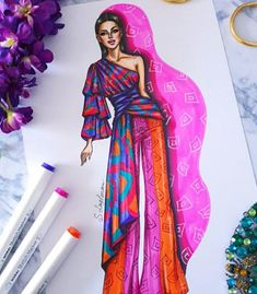 a drawing of a woman in a colorful dress on a piece of paper next to some markers