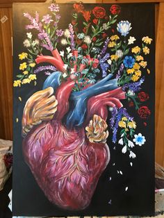 a painting of a heart with flowers in it