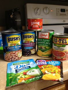 several canned food items on a kitchen counter