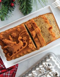 A wonderful holiday treat, showcasing a festive santa loaf design. Add to your holiday recipe list! Decorative Loaf Pan Recipes, Nordic Ware Loaf Pan Recipes, Nordicware Bundt Recipes, Christmas Cake Loaf, Nordic Ware Recipes, Nordicware Recipes, Loaf Pan Recipes, Cinnamon Swirl Loaf