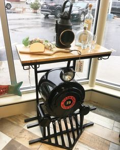 a table that has some food on top of it in front of a large window