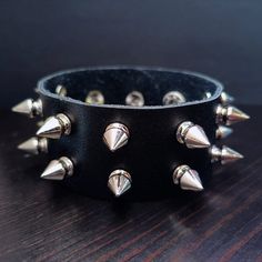 This is a Punk Silver Spike Bracelet. It's a gift for men or women. This will be a perfect gift for your friends. This product is handmade and takes 1 day to make. It will be shipped as soon as possible on the next day. If you have any questions, please contact us with Etsy message. Free Shipping Over $35. All orders have tracking number. Thank you so much : ) Bracelet Grunge, Black Leather Cuff Bracelet, Studded Bracelet, Spike Bracelet, Snap Bracelets, Leather Cuff Bracelet, Men Gifts, Buckle Bracelet, Leather Cuffs Bracelet