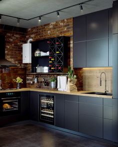 a kitchen with black cabinets and an oven in the center, wine rack on the wall