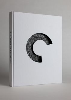 a white book with the letter c on it's cover is shown in black