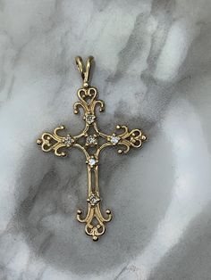 10kt yellow gold cross set with natural diamonds! Weighs 1.4dwt, is 1.50" long and .88" wide! Yellow Gold Filigree Cross Pendant Necklace, Antique Yellow Gold Cross Pendant Jewelry, Hallmarked Yellow Gold Cross Pendant, Diamond-cut Crucifix Cross Necklace, 14k Gold Diamond-cut Cross Pendant, Diamond Cross Pendants, Diamond Cross, Gold Cross, Cross Pendant