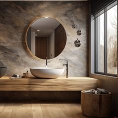 a bathroom with a round mirror above the sink and wood flooring on the walls