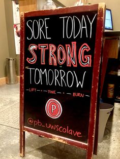 a sign that says sore today strong tomorrow