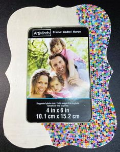 a photo frame with multicolored confetti on it