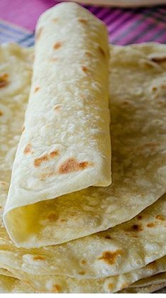 some tortillas are stacked on top of each other