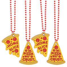 three wooden slices of pizza hanging from red beads