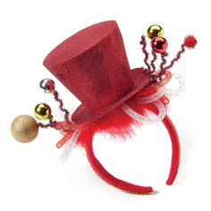 a red top hat with bells and ornaments on it's headband, against a white background