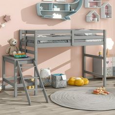 a child's bedroom with pink walls and grey bunk beds