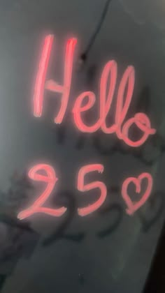 a neon sign that says hello 223