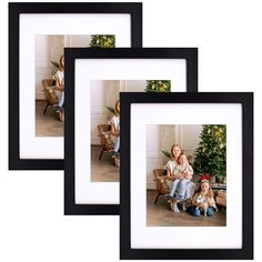 three black frames with pictures of people and a christmas tree in the middle one is holding a baby