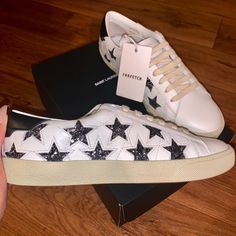 Brand New- Ysl- Saint Laurent Star Sneakers Are A Must Have!! With Sparkle Stars- A Perfect Addition To Your Cool Wardrobe! Bought 5 Months Ago On Farfetch Tags Still In Tacked - Never Used. Size Runs Small!! These Are Darling & I Wish They Fit Me. They Are A Size 40. All Original Packaging , Dust Bags (2) & Extra Laces, Too! I Wish I Could Keep Them! Completely Out Of Stock In Ysl Stores And Online Ysl Lip, Saint Laurent Sneakers, Yves Saint Laurent Shoes, Black Leather Sneakers, Mid Top Sneakers, Embroidered Leather, White Leather Sneakers, Saint Laurent Paris, Trainer Sneakers