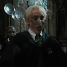 harry potter and the deathly hallowse are standing in front of some balloons