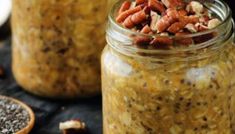 two jars filled with food sitting on top of a table