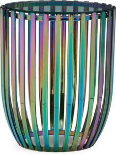 a multicolored glass vase sitting on top of a table