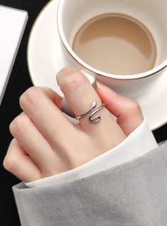 Snake wrap adjustable ring in sterling silver Elegant Open Snake Ring For Gift, Minimalist Adjustable Snake-shaped Ring, Adjustable Minimalist Snake-shaped Rings, Minimalist Adjustable Snake Shape Rings, Modern Open Snake Ring, Adjustable Silver Snake Ring Fine Jewelry, Fine Jewelry Silver Snake-shaped Ring, Adjustable Minimalist Snake Ring, Fine Jewelry Silver Snake Shape Ring