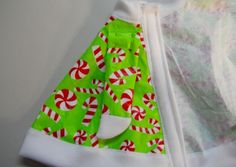 a green and white dress with candy canes on it