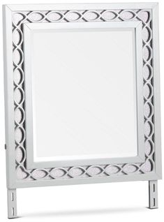 a white mirror sitting on top of a metal stand