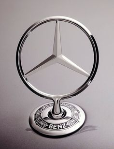 the mercedes benz logo is displayed on a car's hood ornament,