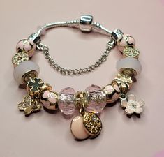 pink butterflies, flowers ,Crystal Stone Beaded Butterfly Bracelet, Snake Chain Bracelet with  Gold Silver and Pink Themed Charms, Beaded Butterfly Bracelet, Pandora Rose Gold Bracelet, Cristal Bracelet, Pandora Style Bracelet, Pandora Rose Gold, Beaded Butterfly, Pandora Rose, Pretty Jewelry Necklaces, Butterflies Flowers