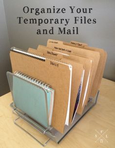 file folders are organized on a desk with the words organize your temporary files and mail