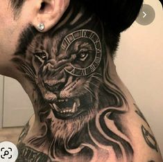 a man with a lion tattoo on his neck and behind him is a large clock