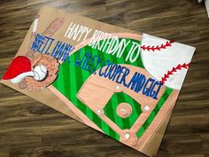 a baseball themed birthday card on the floor