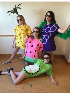 four women dressed in costumes posing for the camera