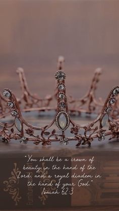 a tiara sitting on top of a wooden table with a bible verse written below it