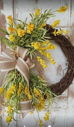 a wreath with yellow flowers tied to it on a white door frame and an instagram post