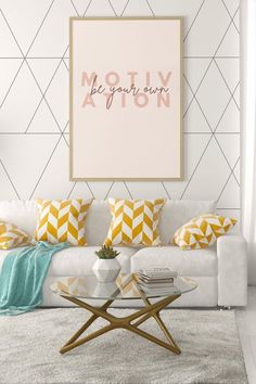 a living room with white couches and colorful pillows on the wall above it is a coffee table