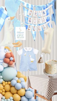 a baby's first birthday party with blue and yellow decorations