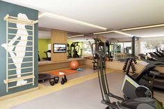 a gym with treadmills, exercise bikes and other equipment