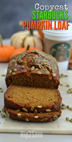 a loaf of pumpkin bread on a cutting board with the words copycat starbucks starbucks pumpkin loaf