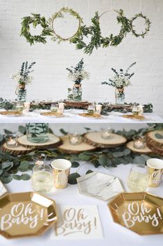 the table is set with gold plates and greenery on it, along with other decorations