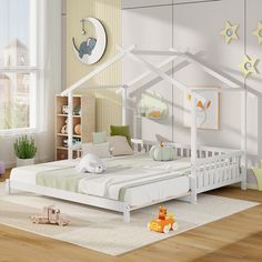 a child's bedroom with a white bed and wooden floors