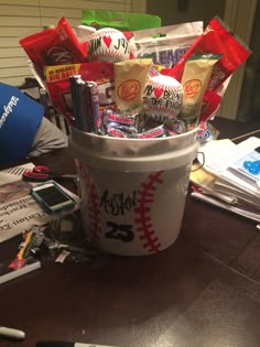 a bucket filled with candy and sports balls