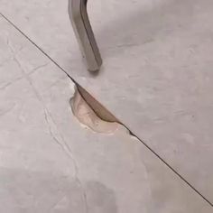 an open hole in the floor with a metal handle