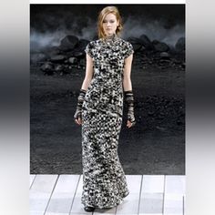 Chanel Fall Runway. Simply Stunning! Chanel Black & White Boucle Knit Cross Back Maxi Fr 36 Size: 4, 6 Chanel This Chanel Fall/Winter Apocalyptic Collection Black And White Boucle Maxi Dress With Fringed Open Back X-Strap Is Versatile For Day Or Night And Transitions Easily From Fall To Winter. There's A Strass Crystal Encrusted Button Closure At The Back Of The Neck. This Dress Is Unlined & Is Composed Of 90% Wool & 10% Nylon. Measurements: French Size 36 Bust 33-36" Waist 24" Hips 36" Length 6 Chanel Tweed Dress, Chanel Gown, Navy Velvet Dress, Chanel Black And White, Fall Runway, Boucle Knit, Luxurious Dresses, Chanel Dress, Cashmere Dress