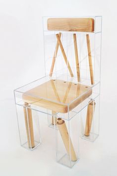 a chair made out of wood and plastic with two wooden handles on each side, sitting in front of a white background