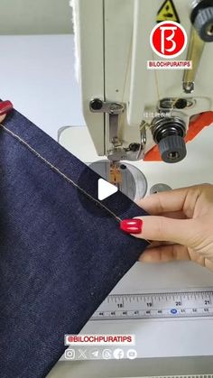 someone is using a sewing machine to sew jeans