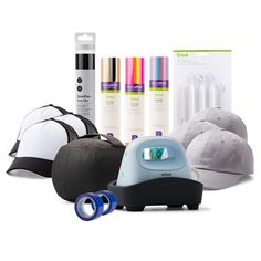 an assortment of items including hats, hairdryer, and other items on a white background