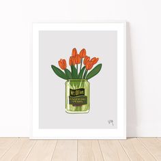 a painting of orange tulips in a green mason jar on a wooden floor