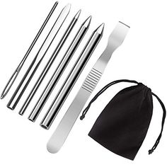 stainless steel kitchen utensils with black drawstrings and pouch on white background