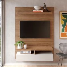 a living room with a television on the wall