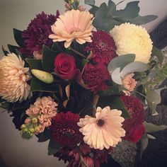 a bouquet of flowers sitting on top of a table