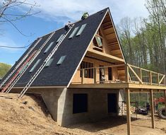 a house being built on top of a hill